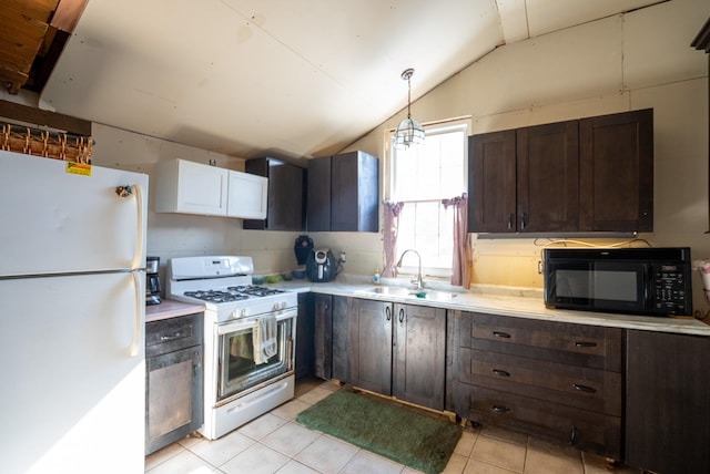 kitchen featuring dark brown cabinetry, sink, hanging light fixtures, vaulted ceiling, and white appliances