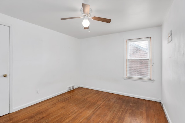 empty room featuring ceiling fan and wood-type flooring