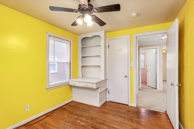 interior space with ceiling fan and hardwood / wood-style flooring