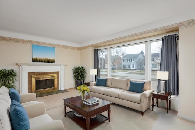 living room featuring a brick fireplace