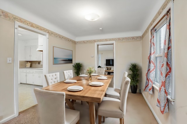 view of carpeted dining area