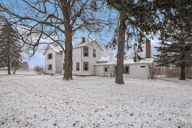 view of snow covered house