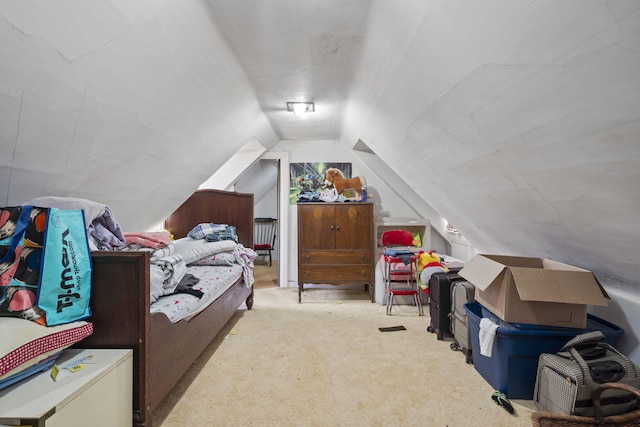 carpeted bedroom featuring vaulted ceiling