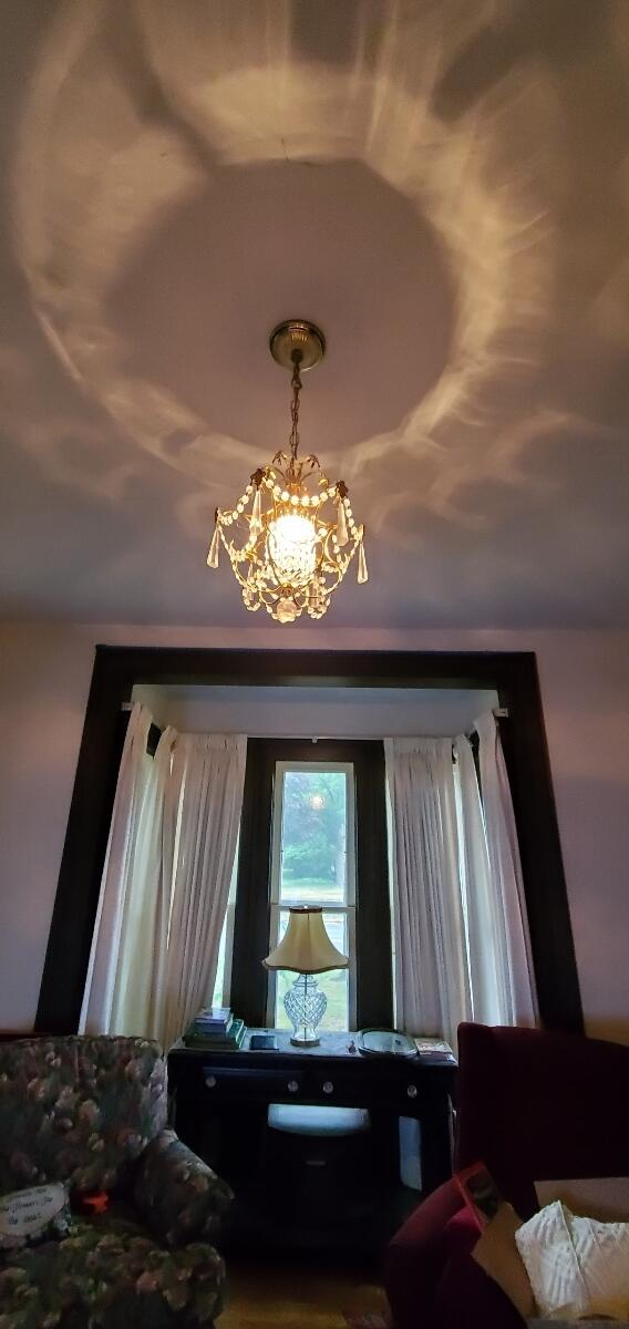 bedroom featuring vaulted ceiling and a notable chandelier