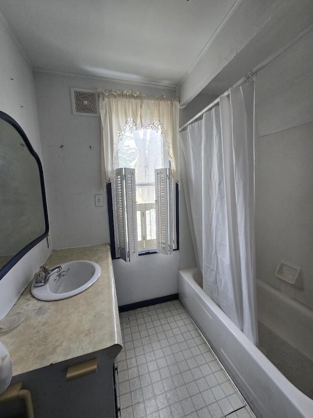 bathroom featuring visible vents, vanity, tile patterned flooring, and shower / bath combination with curtain