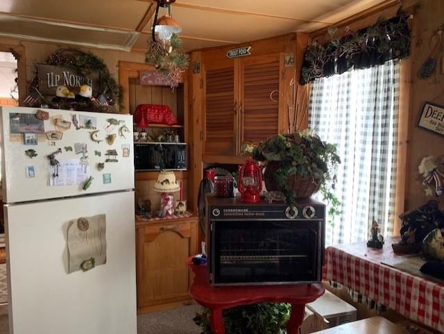 kitchen featuring white refrigerator