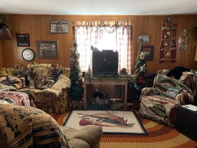 living room with wood walls