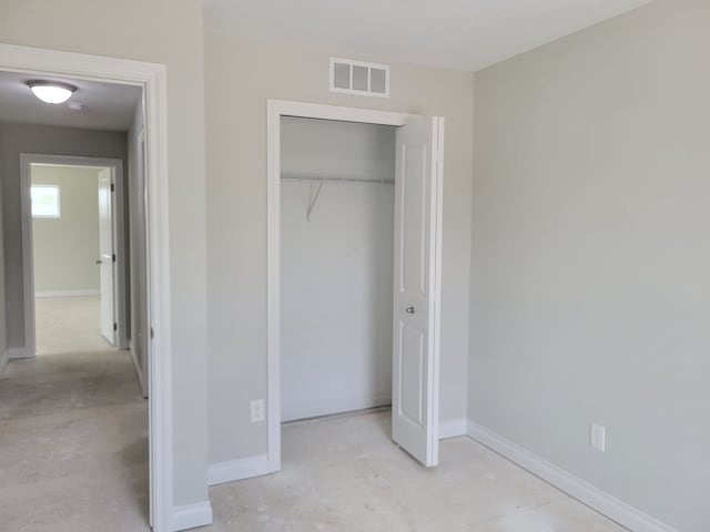 unfurnished bedroom with a closet