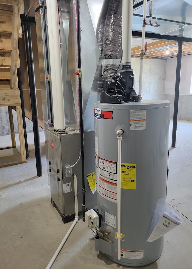 utility room featuring water heater