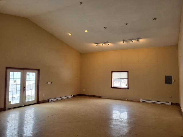 5300 Belford Rd, Holly, MI 48442 - spare room with a baseboard heating unit, concrete flooring, plenty of natural light, and high vaulted ceiling