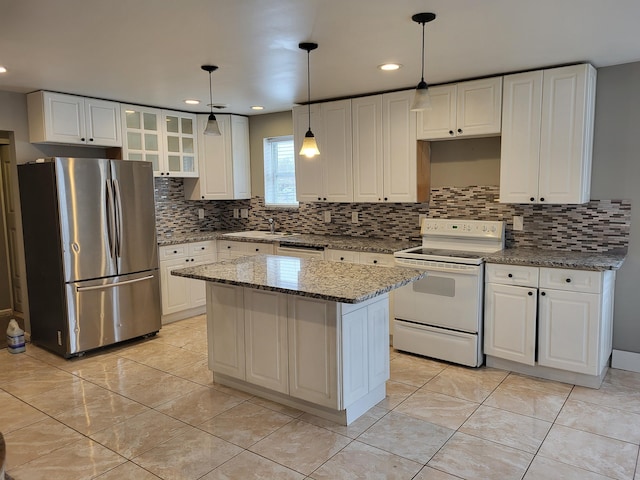 5300 Belford Rd, Holly, MI 48442 - kitchen featuring freestanding refrigerator, electric stove, backsplash, white cabinetry, and glass insert cabinets