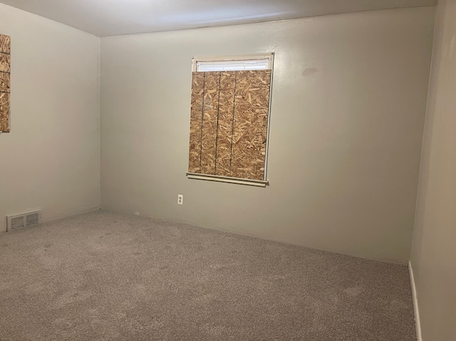 empty room featuring carpet flooring