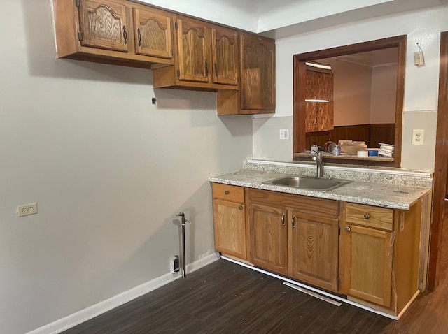 kitchen with dark wood-type flooring and sink