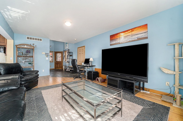 living room with wood-type flooring