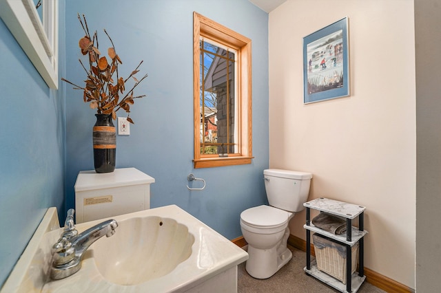 bathroom with toilet and sink