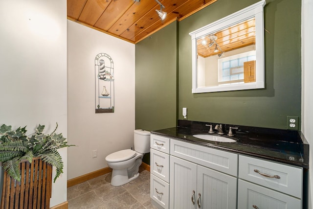 bathroom with tile patterned floors, vanity, toilet, and wood ceiling