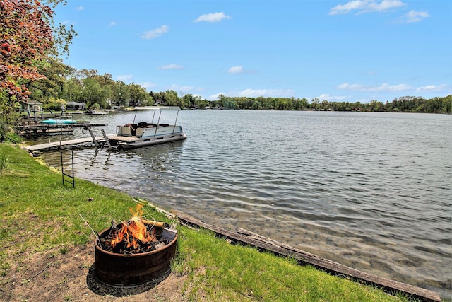 dock area with a water view and a fire pit