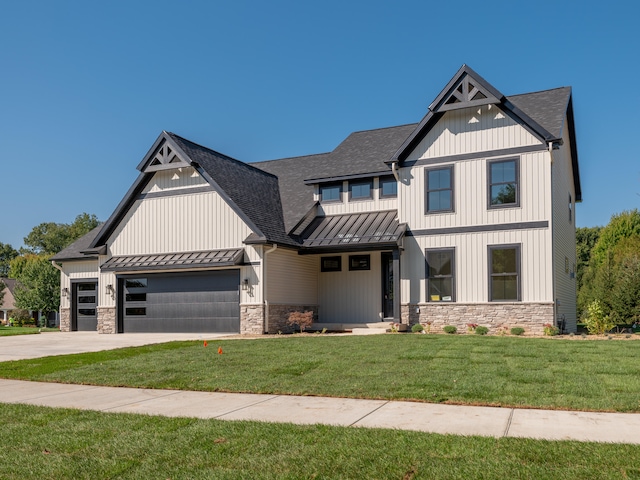 view of front facade featuring a garage and a front lawn