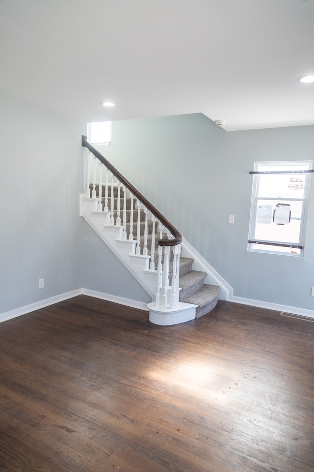 stairs with hardwood / wood-style flooring