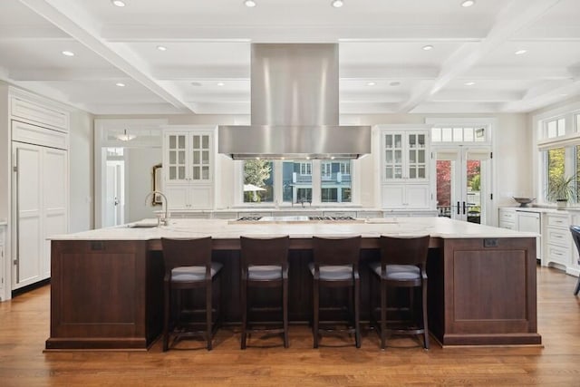 49106 Sun Valley Falls Blvd, New Buffalo, MI 49117 - kitchen featuring coffered ceiling, island range hood, a large island with sink, recessed lighting, and a sink