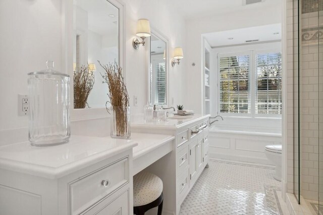 49106 Sun Valley Falls Blvd, New Buffalo, MI 49117 - bathroom with vanity, a garden tub, and toilet