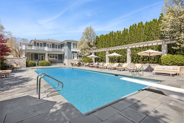 49106 Sun Valley Falls Blvd, New Buffalo, MI 49117 - community pool with a patio, an outdoor living space, a diving board, and a pergola