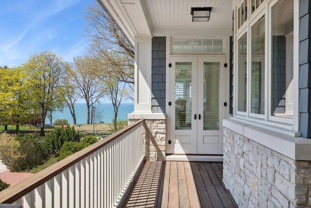 49106 Sun Valley Falls Blvd, New Buffalo, MI 49117 - wooden terrace with french doors and a water view
