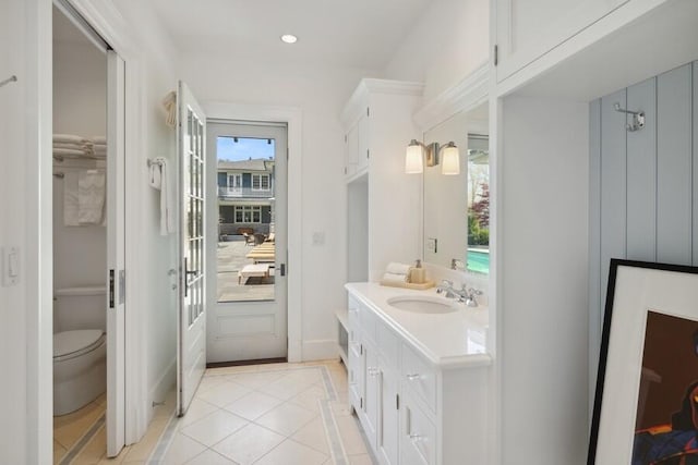 49106 Sun Valley Falls Blvd, New Buffalo, MI 49117 - full bathroom featuring inlaid floor details, vanity, toilet, recessed lighting, and baseboards