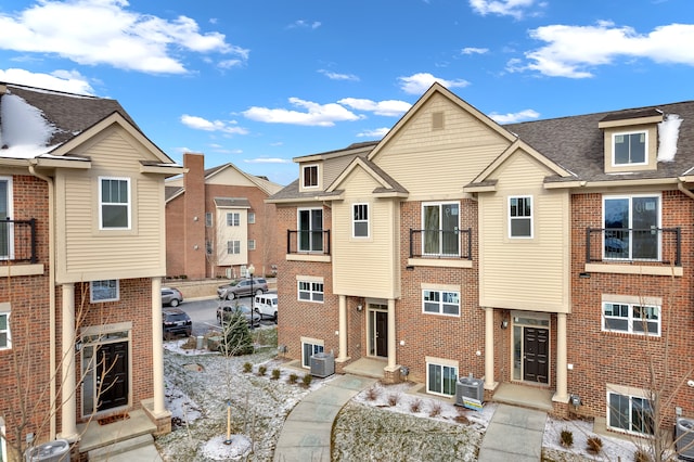 view of property featuring central AC unit