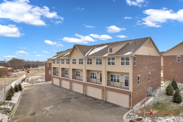 view of side of property with a garage