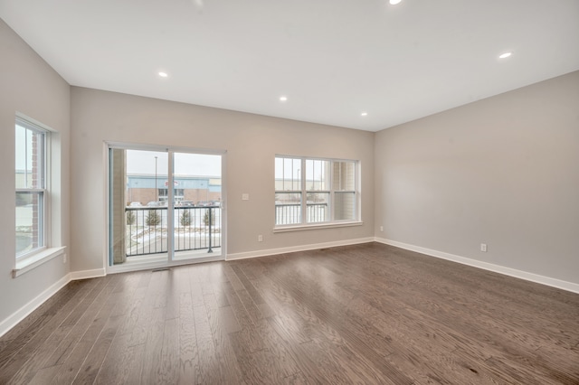 unfurnished room featuring dark hardwood / wood-style flooring