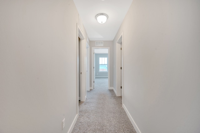 corridor with light carpet