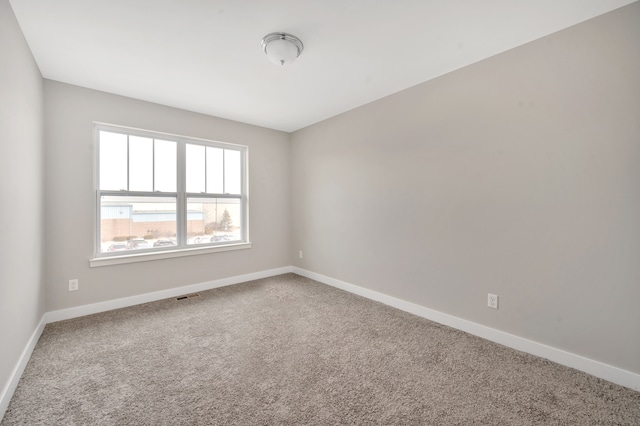 empty room with carpet flooring