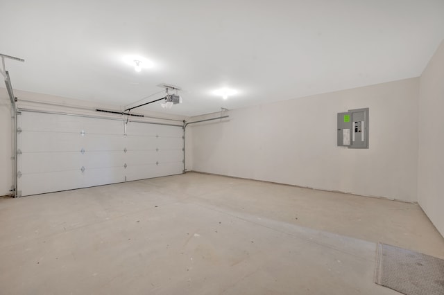 garage with a garage door opener and electric panel