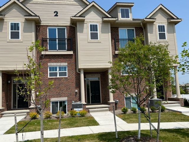 view of front of home with a balcony