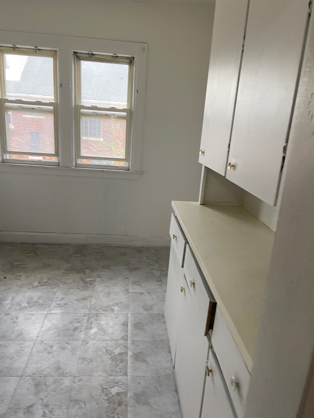 interior space with white cabinetry