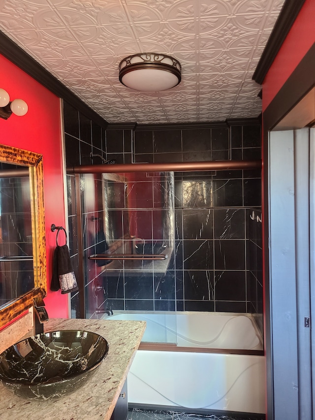 bathroom featuring vanity and enclosed tub / shower combo