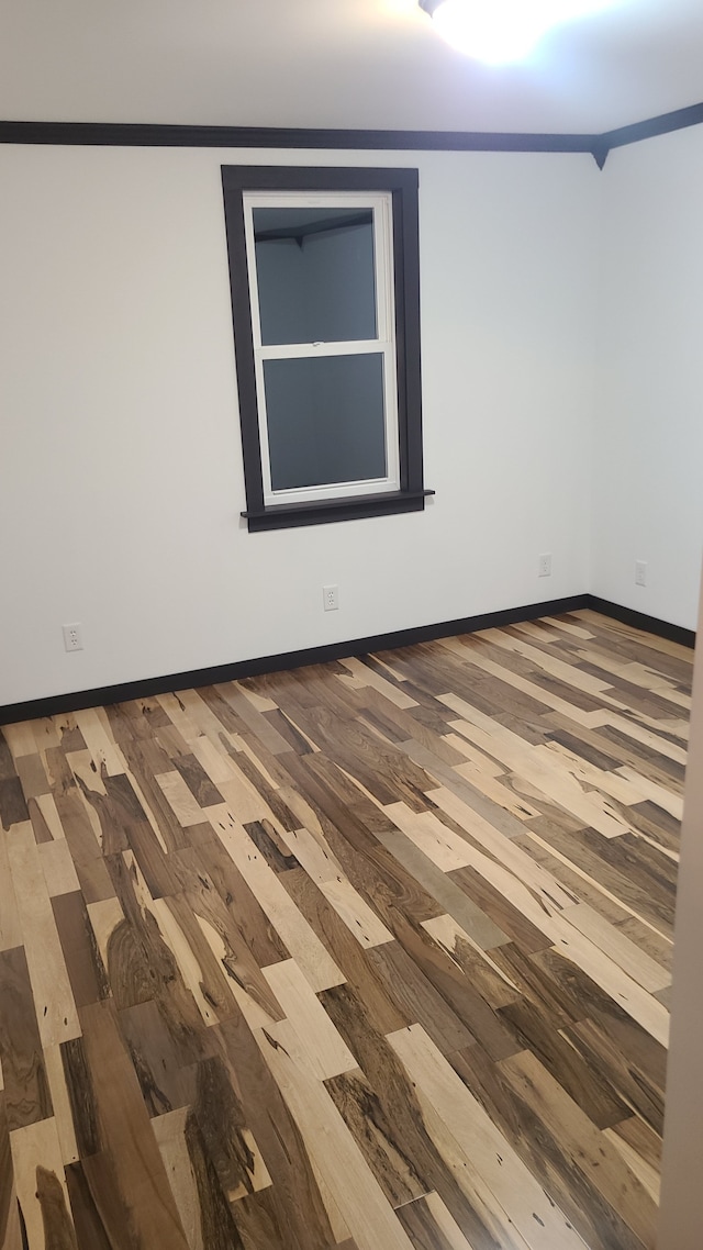 spare room featuring hardwood / wood-style flooring