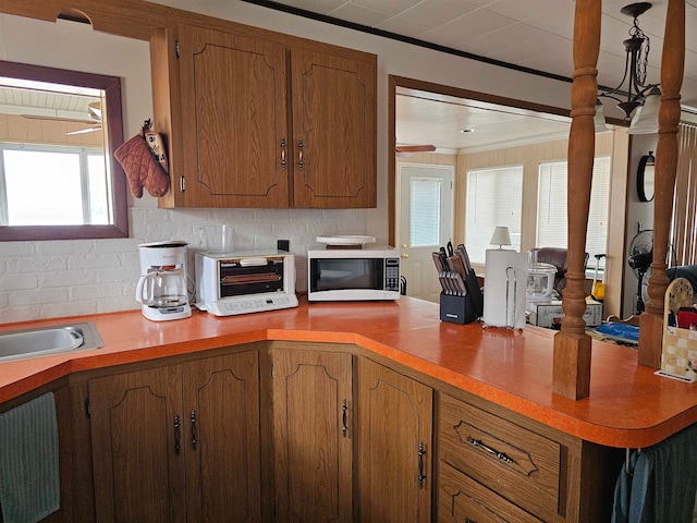 kitchen with tasteful backsplash and crown molding