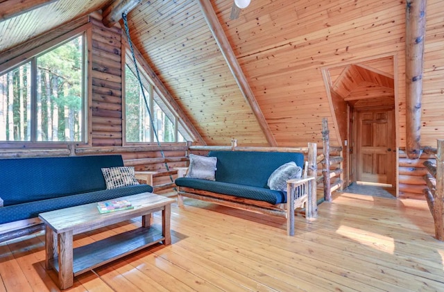 living room featuring light hardwood / wood-style floors, wood ceiling, and rustic walls