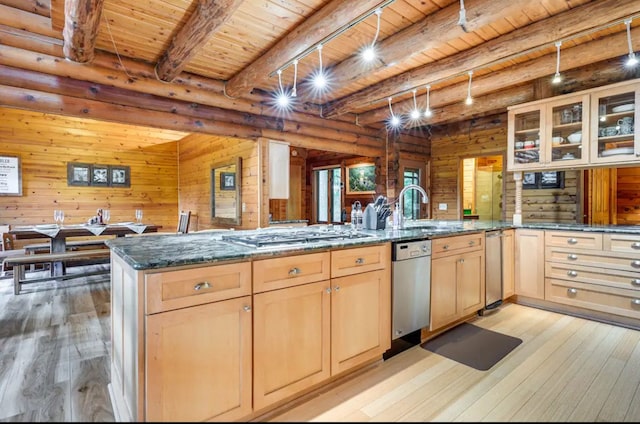 kitchen featuring beamed ceiling, wooden ceiling, and light wood-type flooring