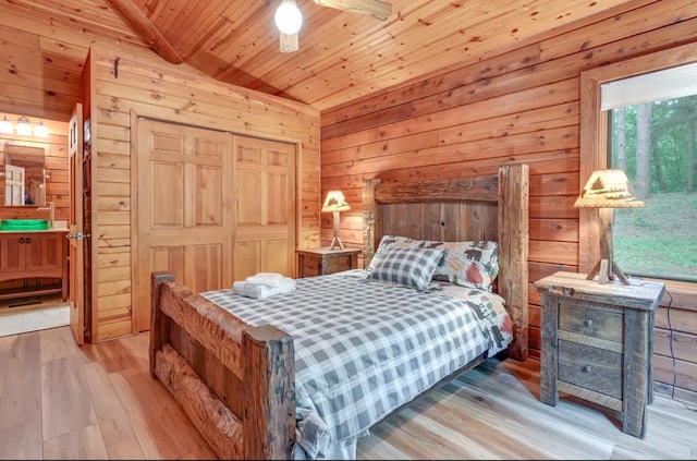 bedroom featuring wood walls, wooden ceiling, lofted ceiling with beams, ceiling fan, and light wood-type flooring