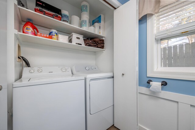 clothes washing area featuring washer and dryer