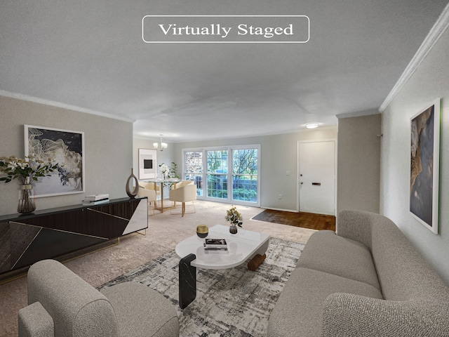 carpeted living room with a notable chandelier and ornamental molding