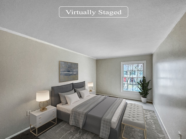 carpeted bedroom featuring a textured ceiling