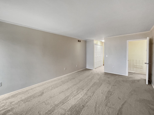 empty room featuring light colored carpet