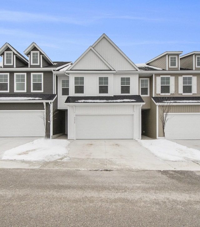 townhome / multi-family property featuring a garage