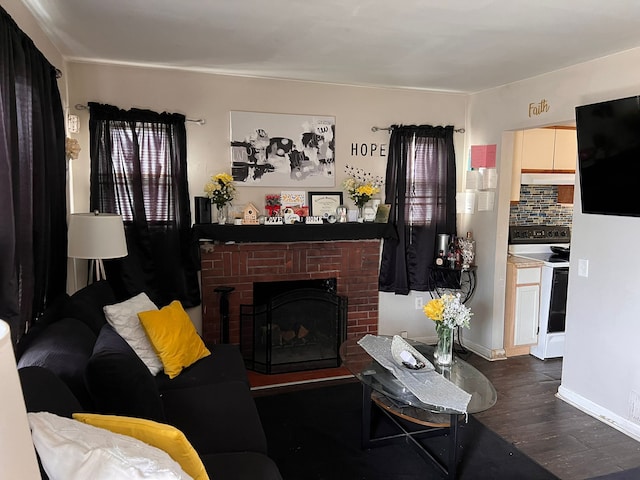 living room featuring dark hardwood / wood-style floors and a fireplace