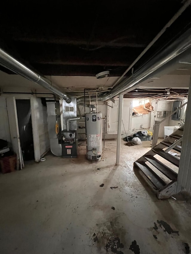 basement with heating unit and water heater