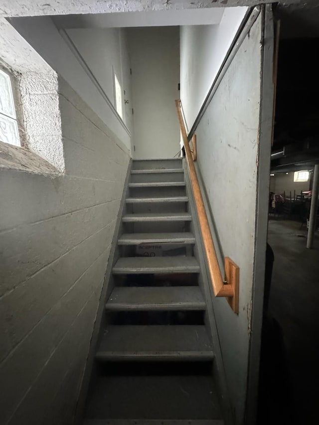 20920/2 Moross Rd, Grosse Pointe, MI 48236 - staircase featuring concrete block wall